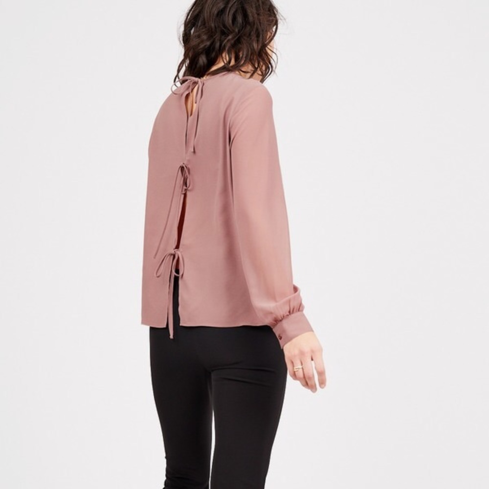 Long sleeved, tied in back blouse
